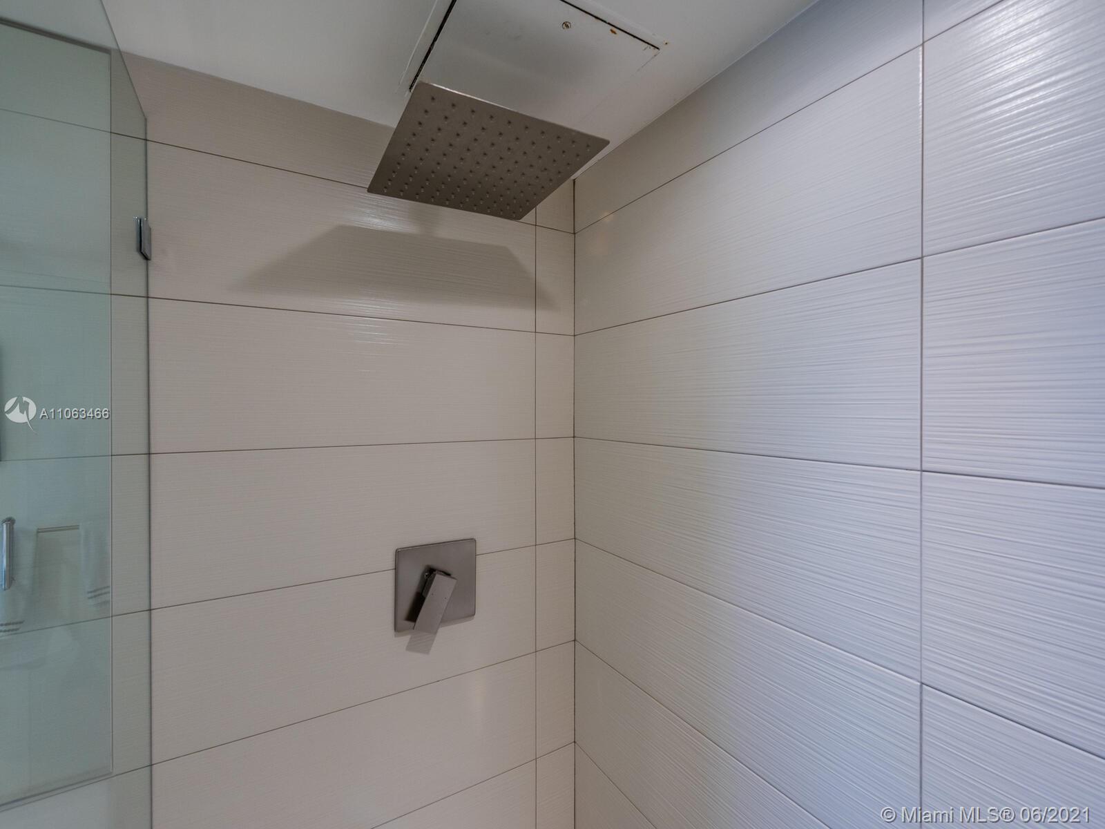 151 Crandon Boulevard, Unit 736 Key Biscayne, FL 33149 - Photo 27 of 38 a bathroom with a shower