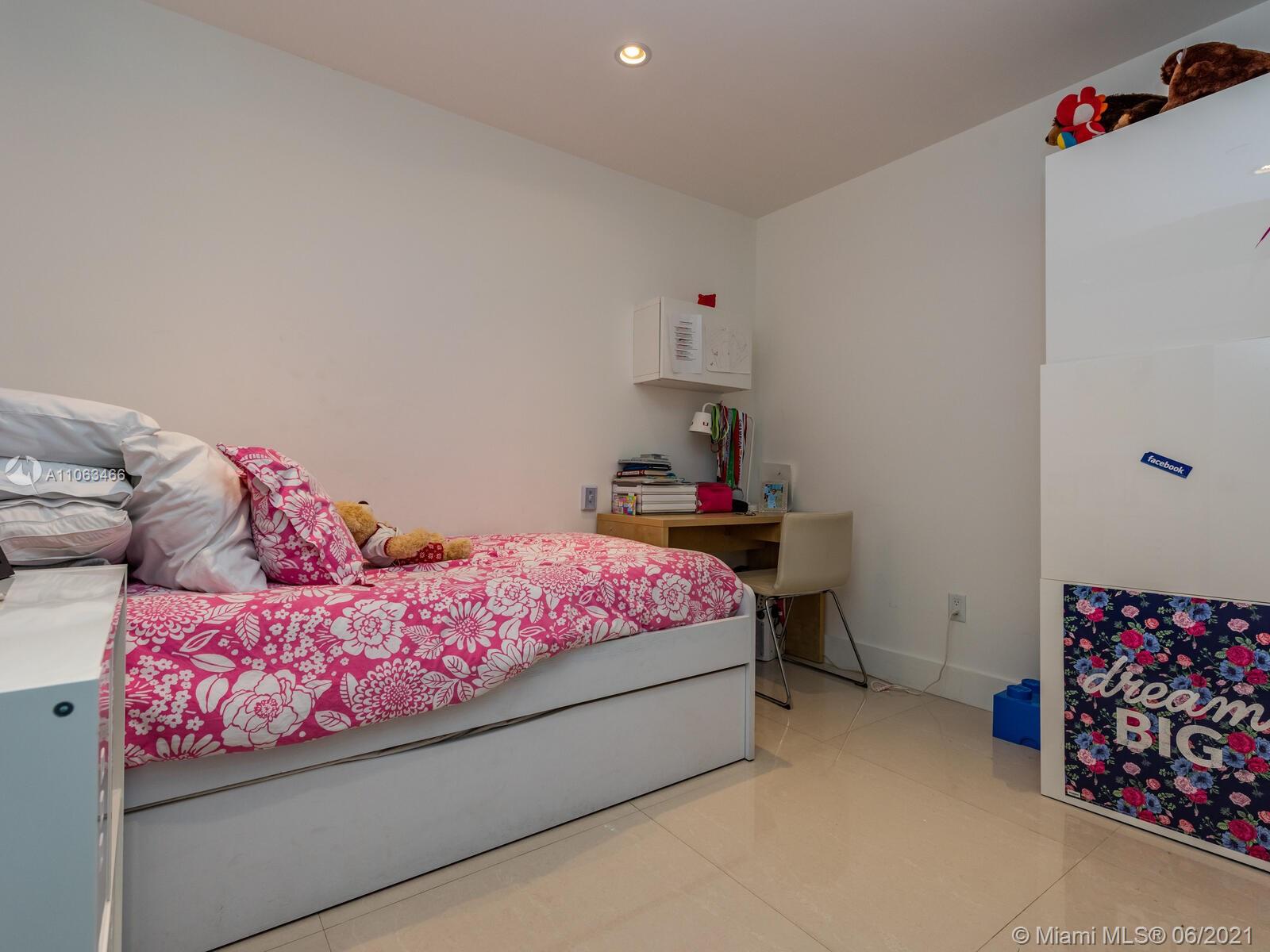 151 Crandon Boulevard, Unit 736 Key Biscayne, FL 33149 - Photo 32 of 38 a bedroom with a bed and a dresser