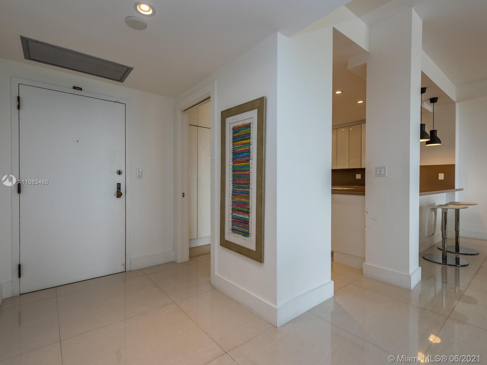 151 Crandon Boulevard, Unit 736 Key Biscayne, FL 33149 - Photo 5 of 38 a view of a hallway to rooms and stairs