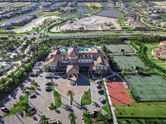a view of swimming pool with outdoor seating and plants