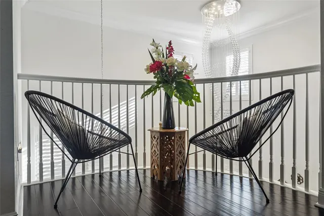 a view of staircase with wooden floor and a potted plant