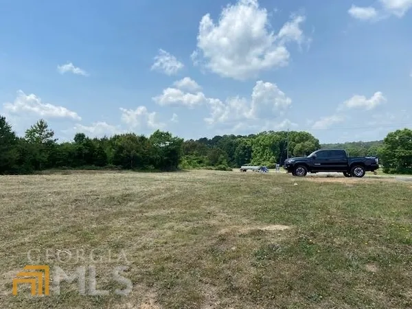 a view of a lake with a yard