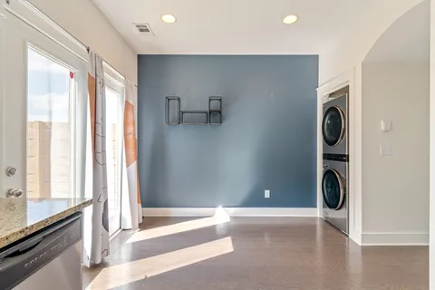 a view of a kitchen with a sink dryer and washer