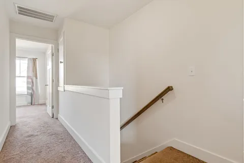 a view of a hallway with closet