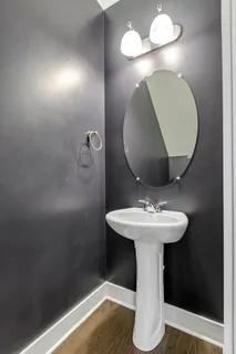 a bathroom with a sink and mirror