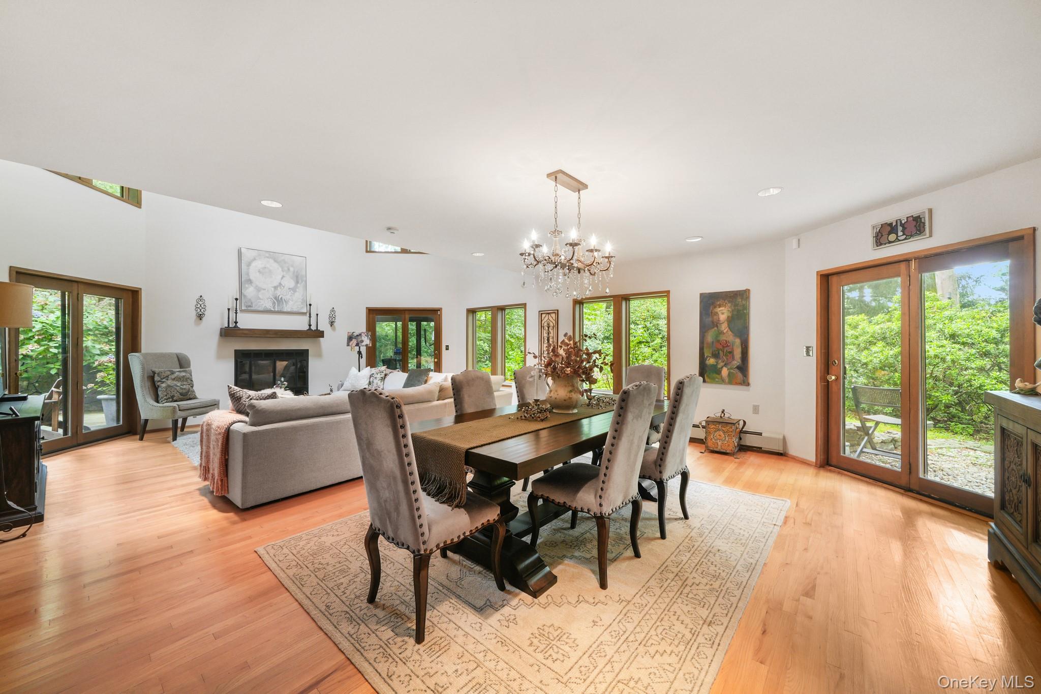 155 Revolutionary Road Briarcliff Manor, NY 10510 - Photo 12 of 30 a view of a dining room with furniture wooden floor and chandelier