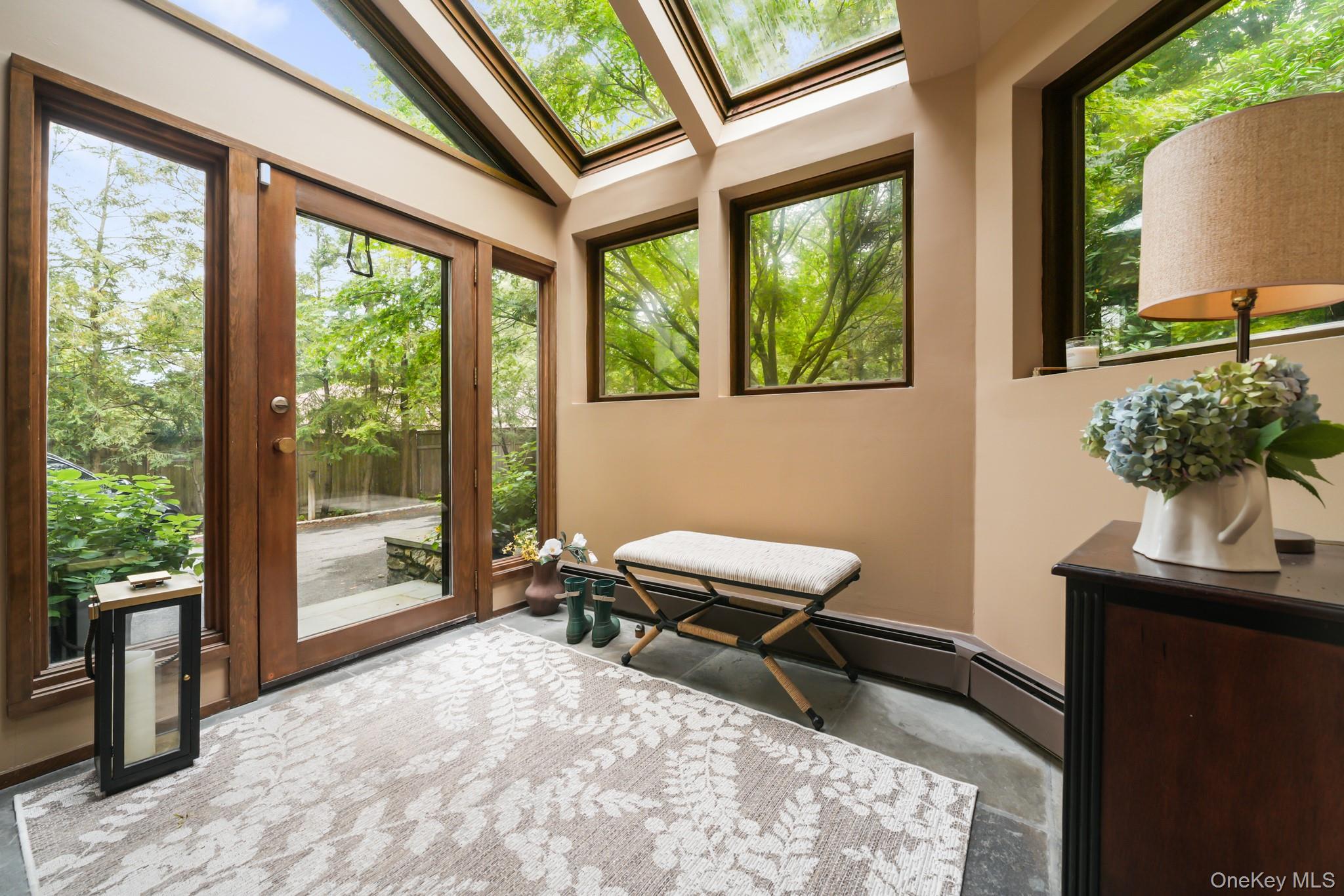 155 Revolutionary Road Briarcliff Manor, NY 10510 - Photo 14 of 30 a room with a large window and chair