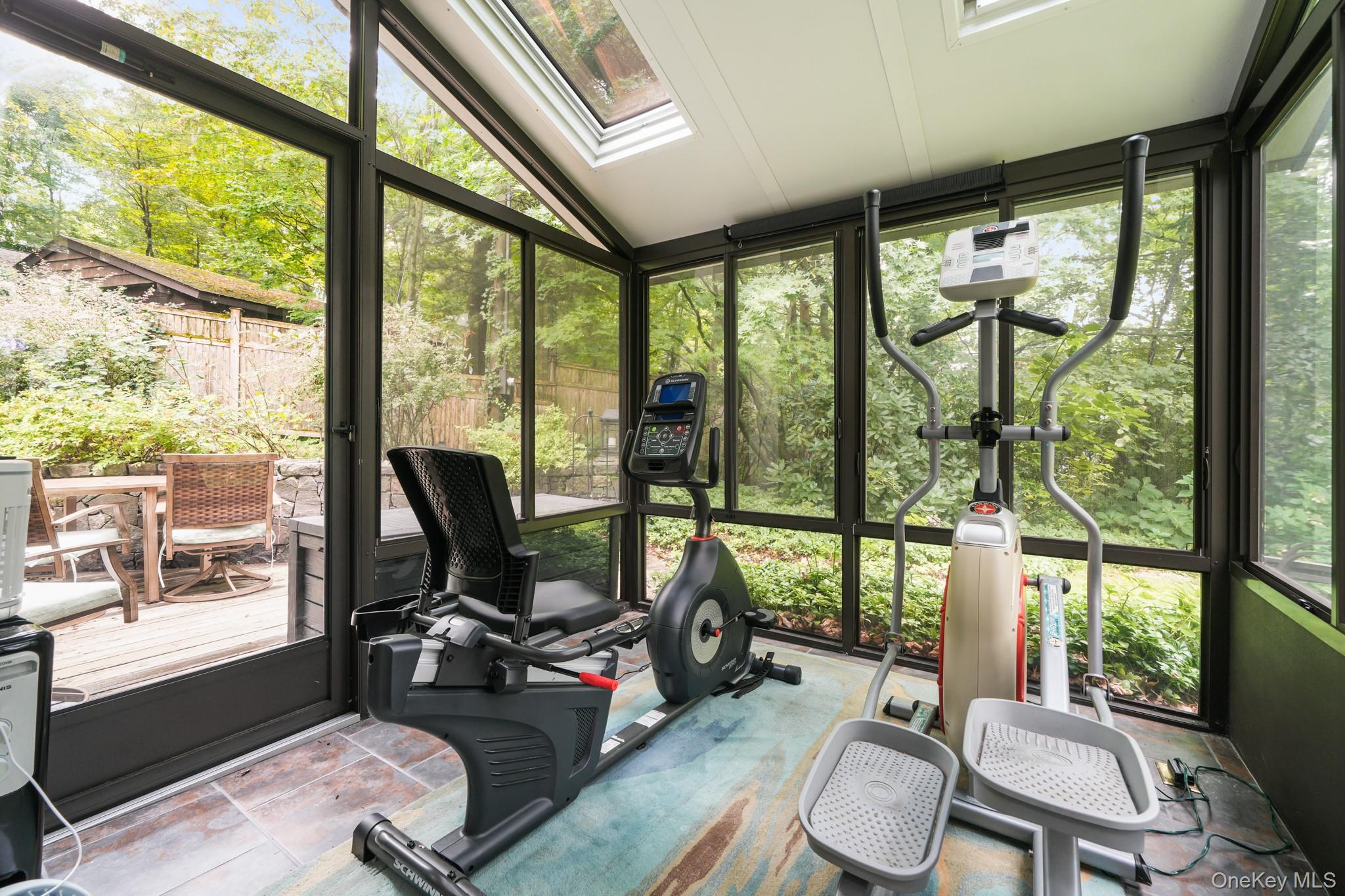 155 Revolutionary Road Briarcliff Manor, NY 10510 - Photo 16 of 30 a view of a room with furniture and floor to ceiling windows