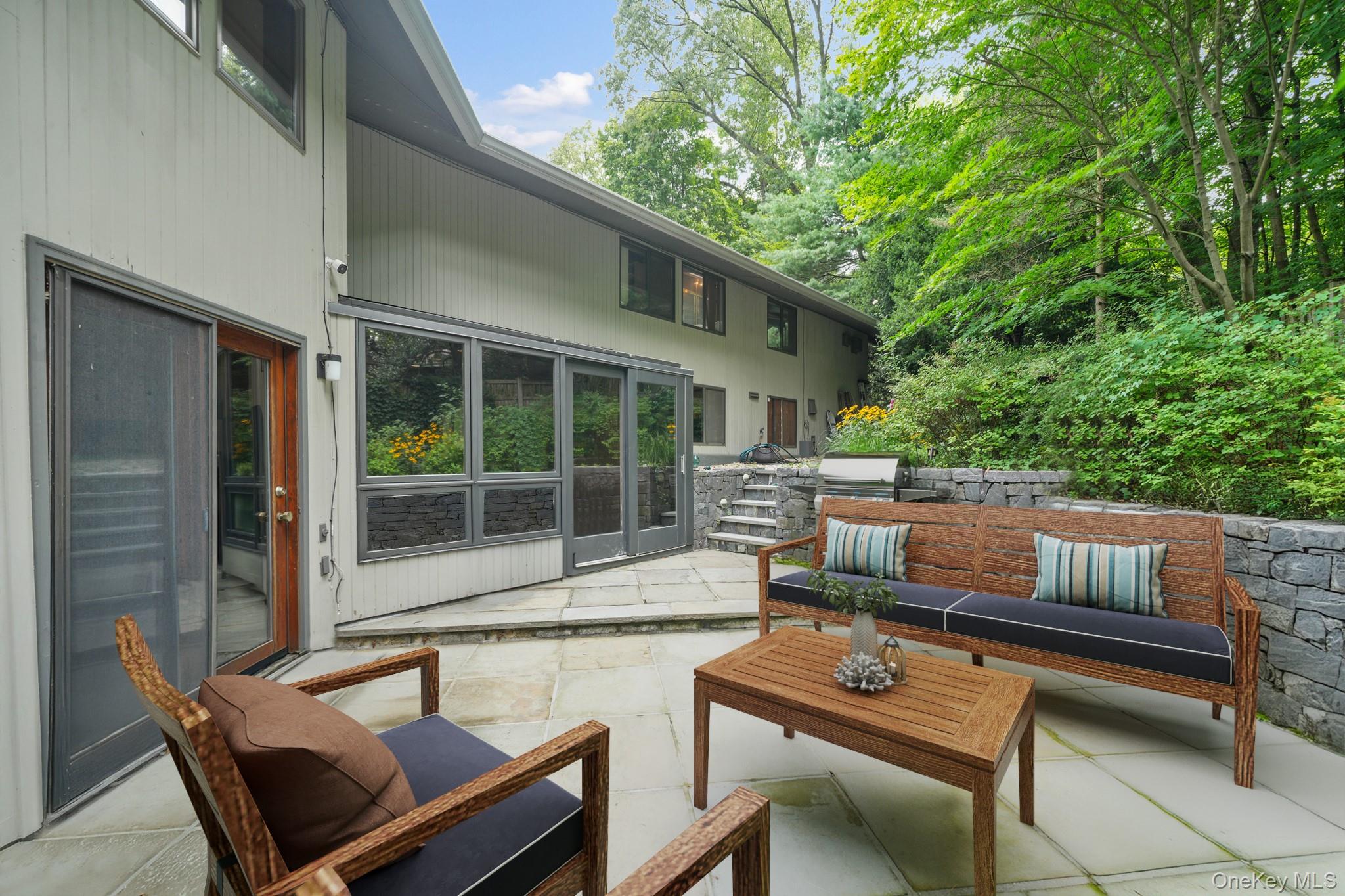 155 Revolutionary Road Briarcliff Manor, NY 10510 - Photo 23 of 30 a patio with patio a couch and chairs