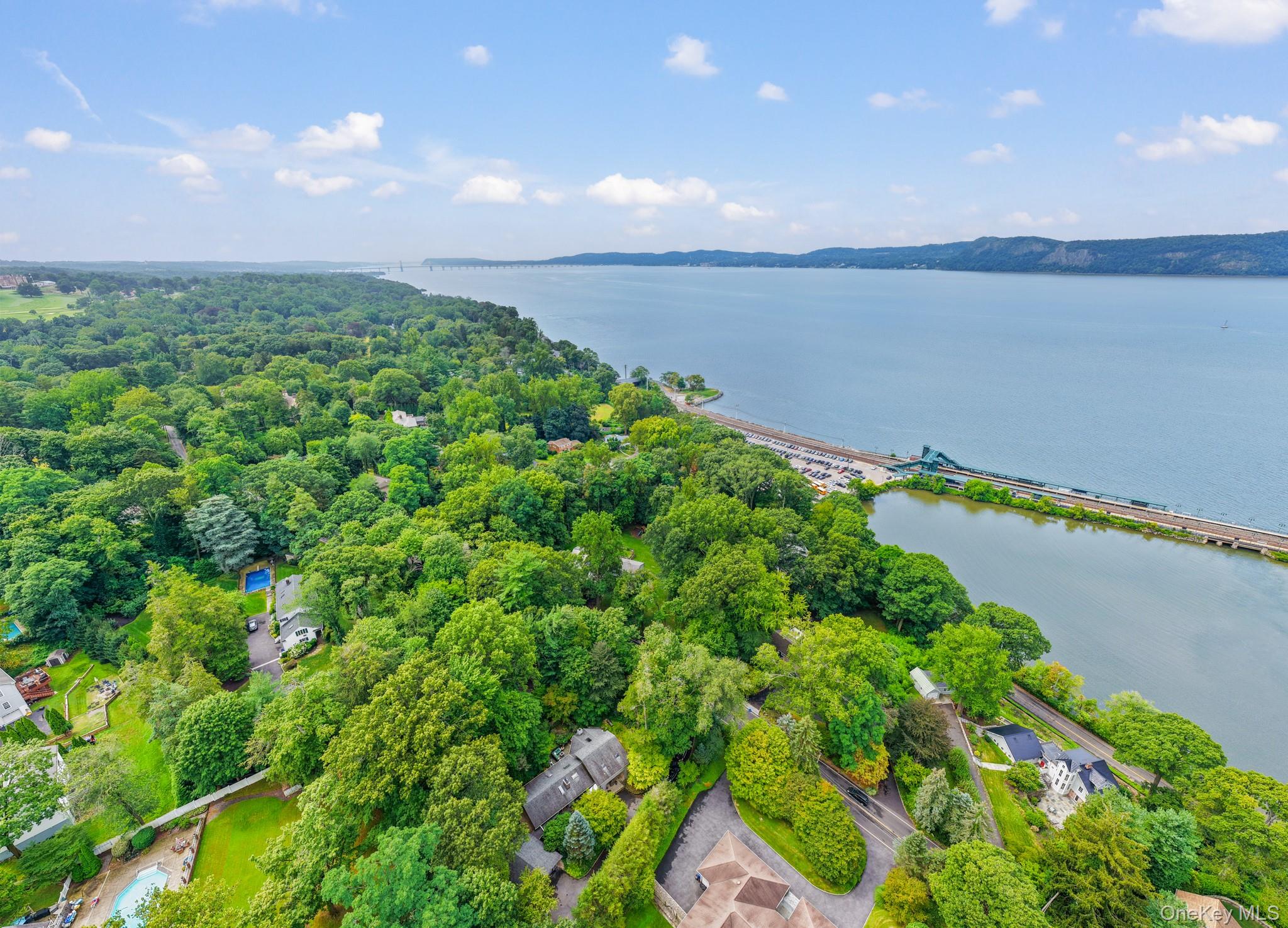 155 Revolutionary Road Briarcliff Manor, NY 10510 - Photo 26 of 30 a view of a lake with a city