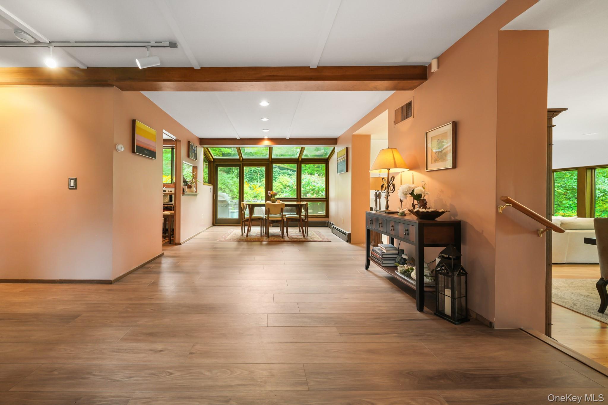 155 Revolutionary Road Briarcliff Manor, NY 10510 - Photo 3 of 30 a view of an entryway with wooden floor and windows