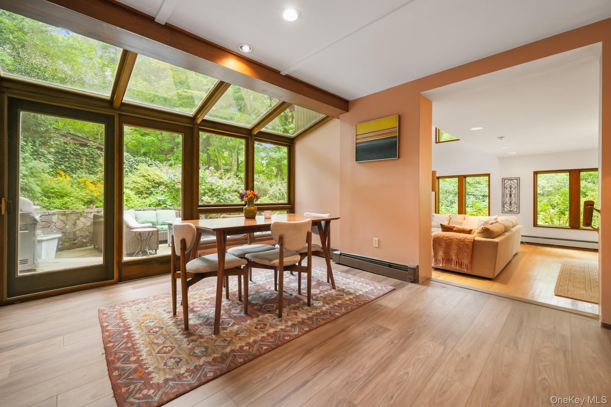 155 Revolutionary Road Briarcliff Manor, NY 10510 - Photo 6 of 30 a view of a dining room with furniture window and wooden floor