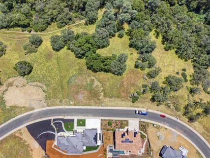 an aerial view of residential house with an outdoor space