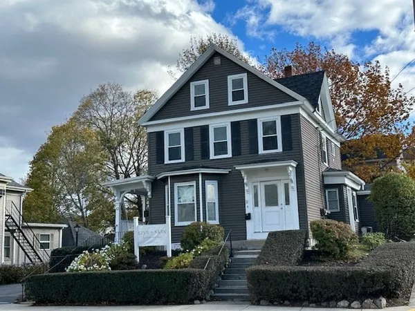 a front view of a house with a yard
