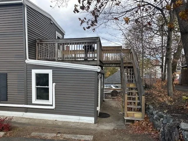a view of a house with a door and wooden floor