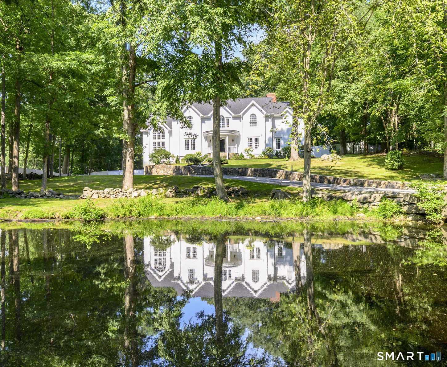 333 Rock Rimmon Road Stamford, CT 06903 - Photo 3 of 40 Beautiful pond view from many rooms. Pond filled with fish.