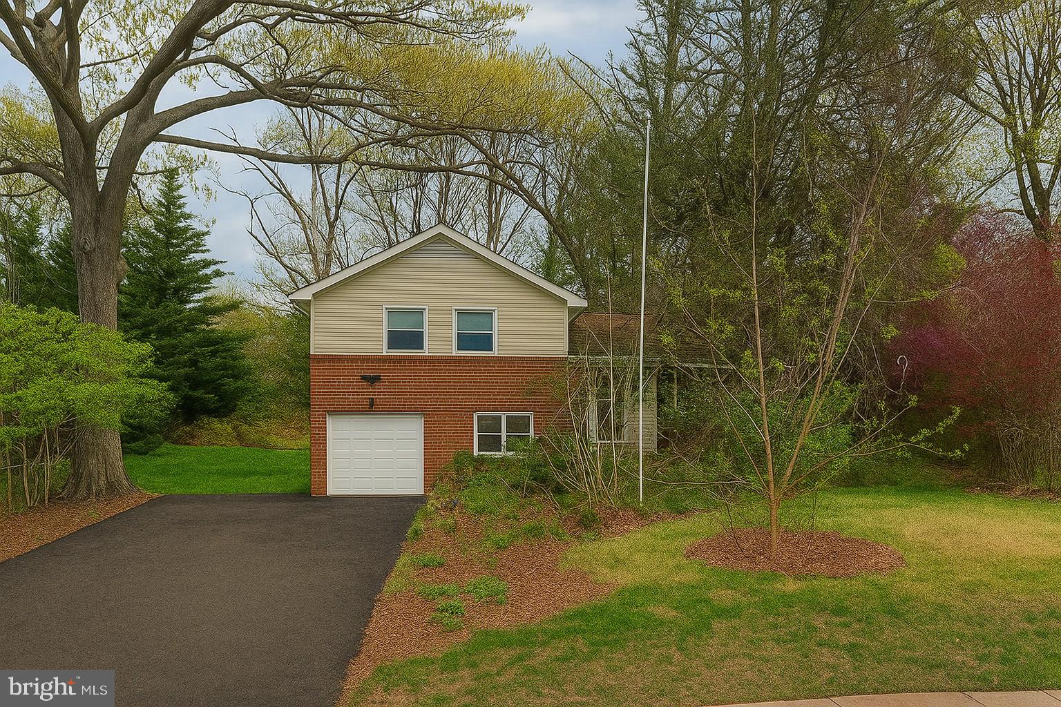 239 Old Courthouse Road Northeast Vienna, VA 22180 - Photo 1 of 1 a front view of a house with a yard and garage