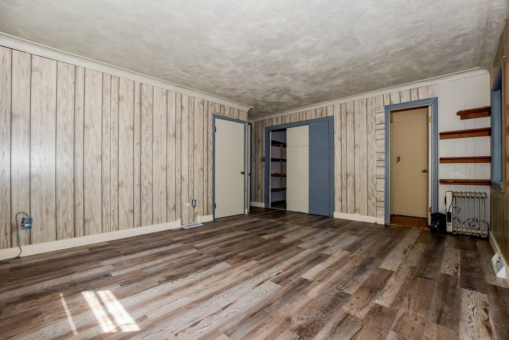 6 Gilbert Way Wareham, MA 02571 - Photo 24 of 41 a view of a bedroom with wooden floor and a window