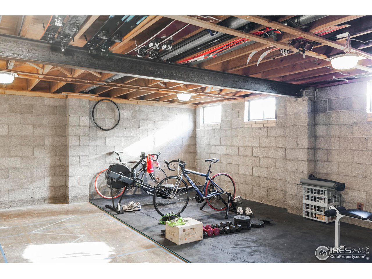 2870 15th Street Boulder, CO 80304 - Photo 16 of 21 The unfinished walk-out lower level presents an exciting opportunity for expansion with generous square footage and exceptional potential-whether you envision a home gym, additional living space, en suite guest area, or a custom renovation.