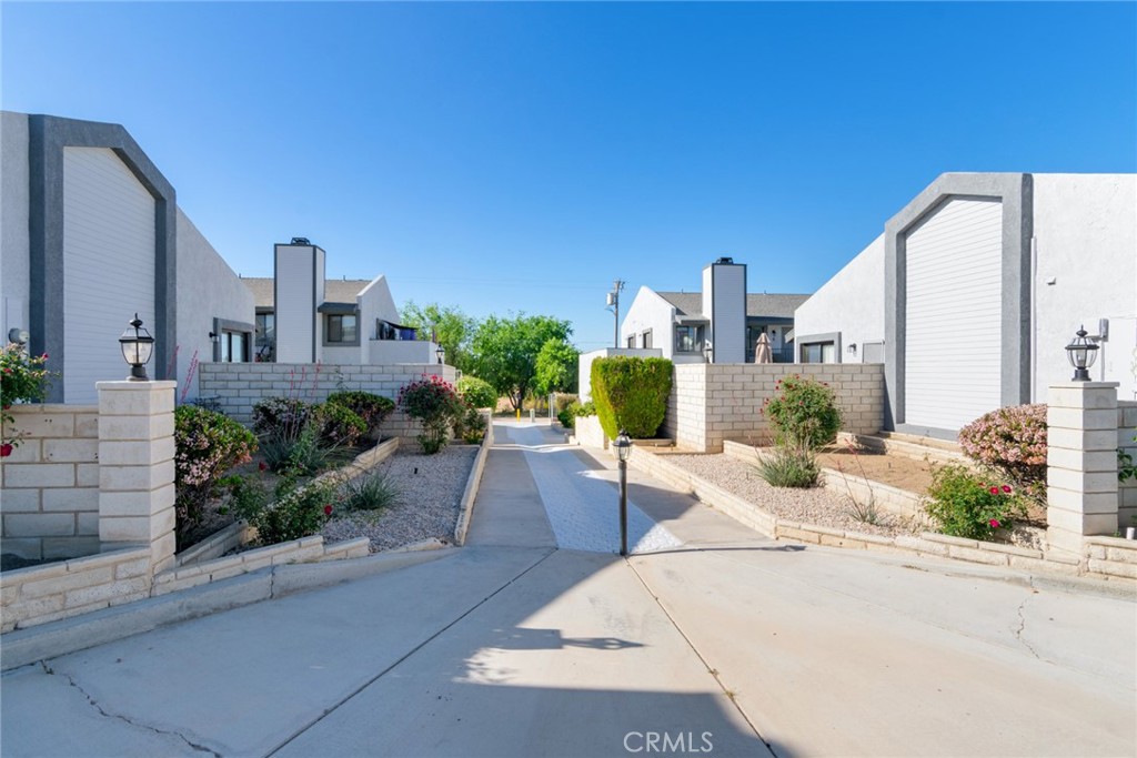 19087 Allegheny Road Apple Valley, CA 92307 - Photo 20 of 47 a view of a building with potted plants