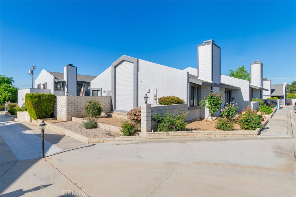 19087 Allegheny Road Apple Valley, CA 92307 - Photo 22 of 47 a view of a building with potted plants