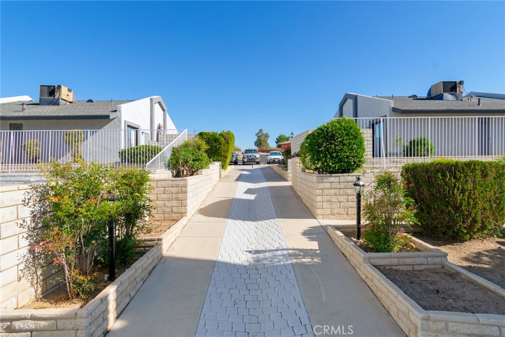 19087 Allegheny Road Apple Valley, CA 92307 - Photo 29 of 47 a view of a house with wooden floor and a yard