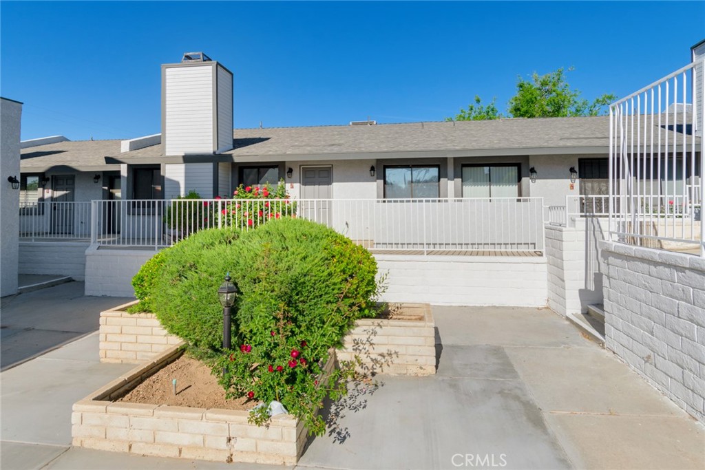 19087 Allegheny Road Apple Valley, CA 92307 - Photo 30 of 47 a front view of a house with garden