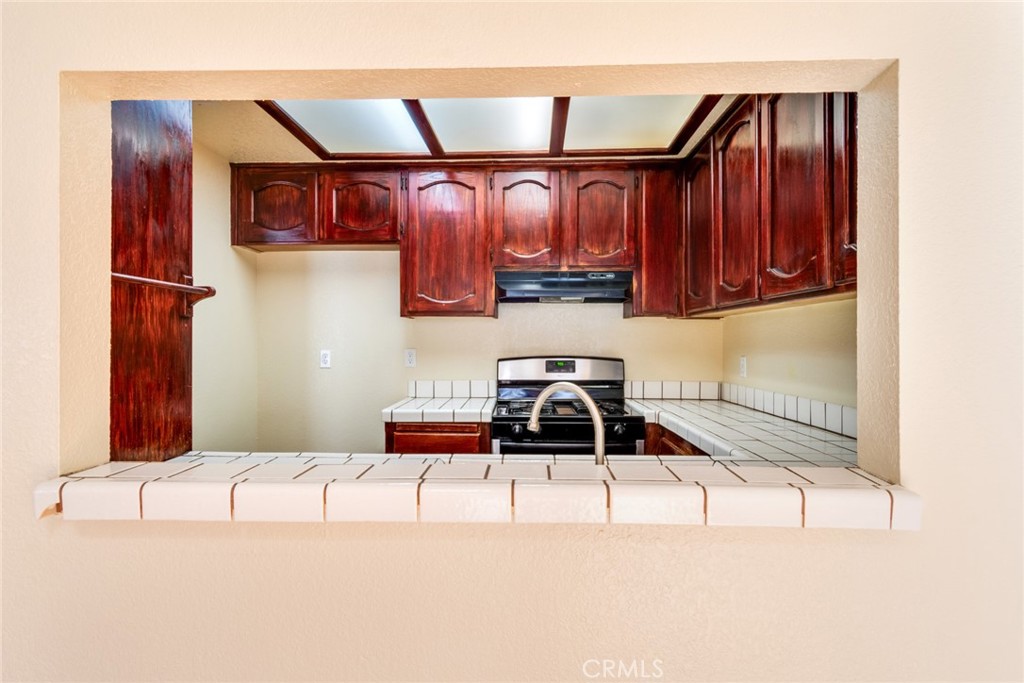 19087 Allegheny Road Apple Valley, CA 92307 - Photo 38 of 47 a kitchen with a cabinets and appliances