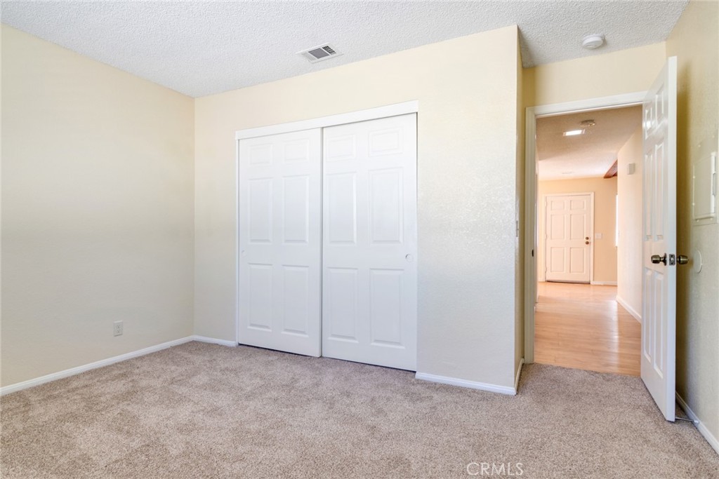 19087 Allegheny Road Apple Valley, CA 92307 - Photo 43 of 47 an empty room with closet area