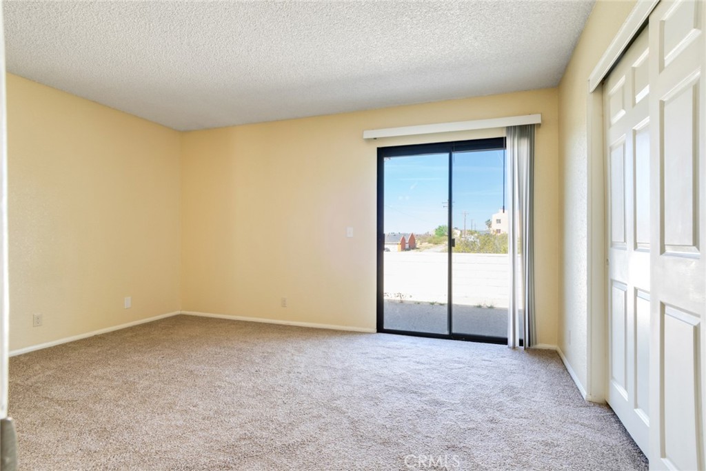 19087 Allegheny Road Apple Valley, CA 92307 - Photo 45 of 47 an empty room with windows