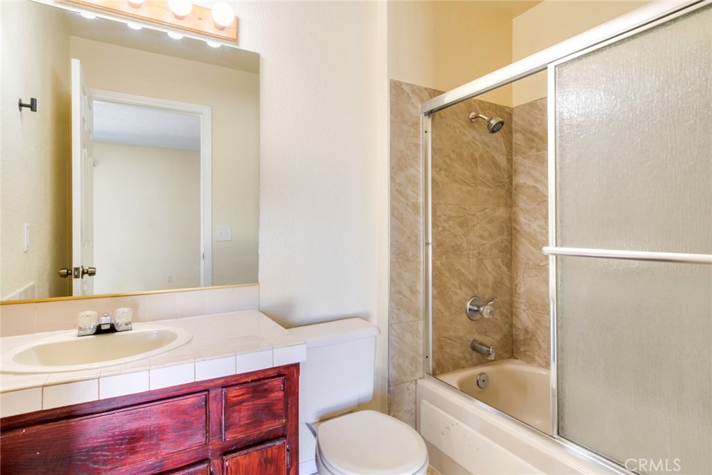 19087 Allegheny Road Apple Valley, CA 92307 - Photo 47 of 47 a bathroom with a sink toilet tub and shower