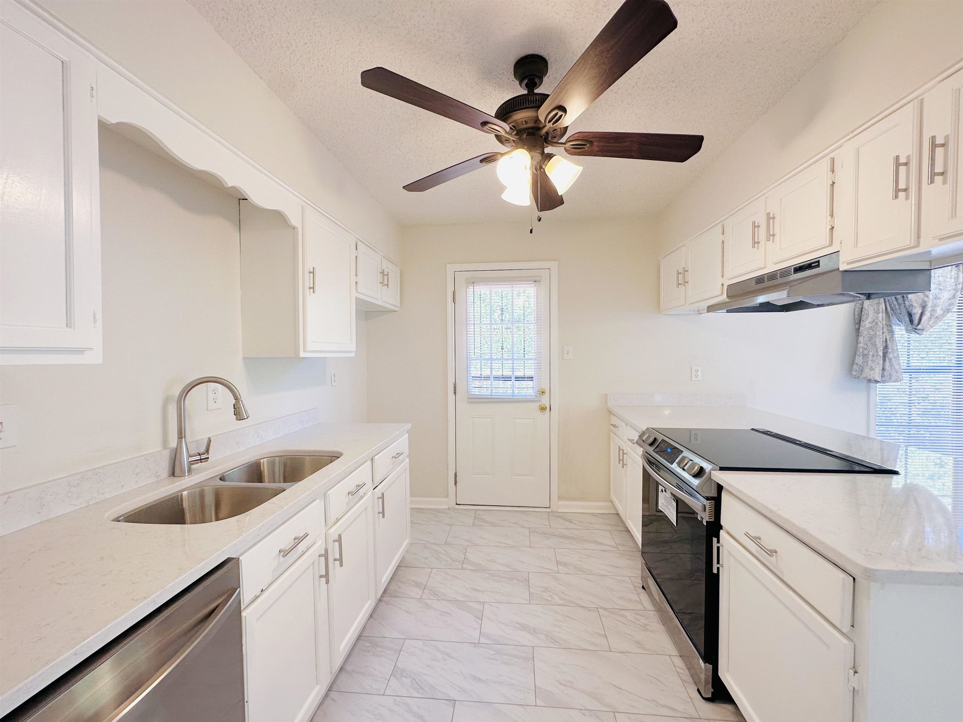 4192 Riche Road Memphis, TN 38128 - Photo 15 of 32 a kitchen with a sink and a stove top oven