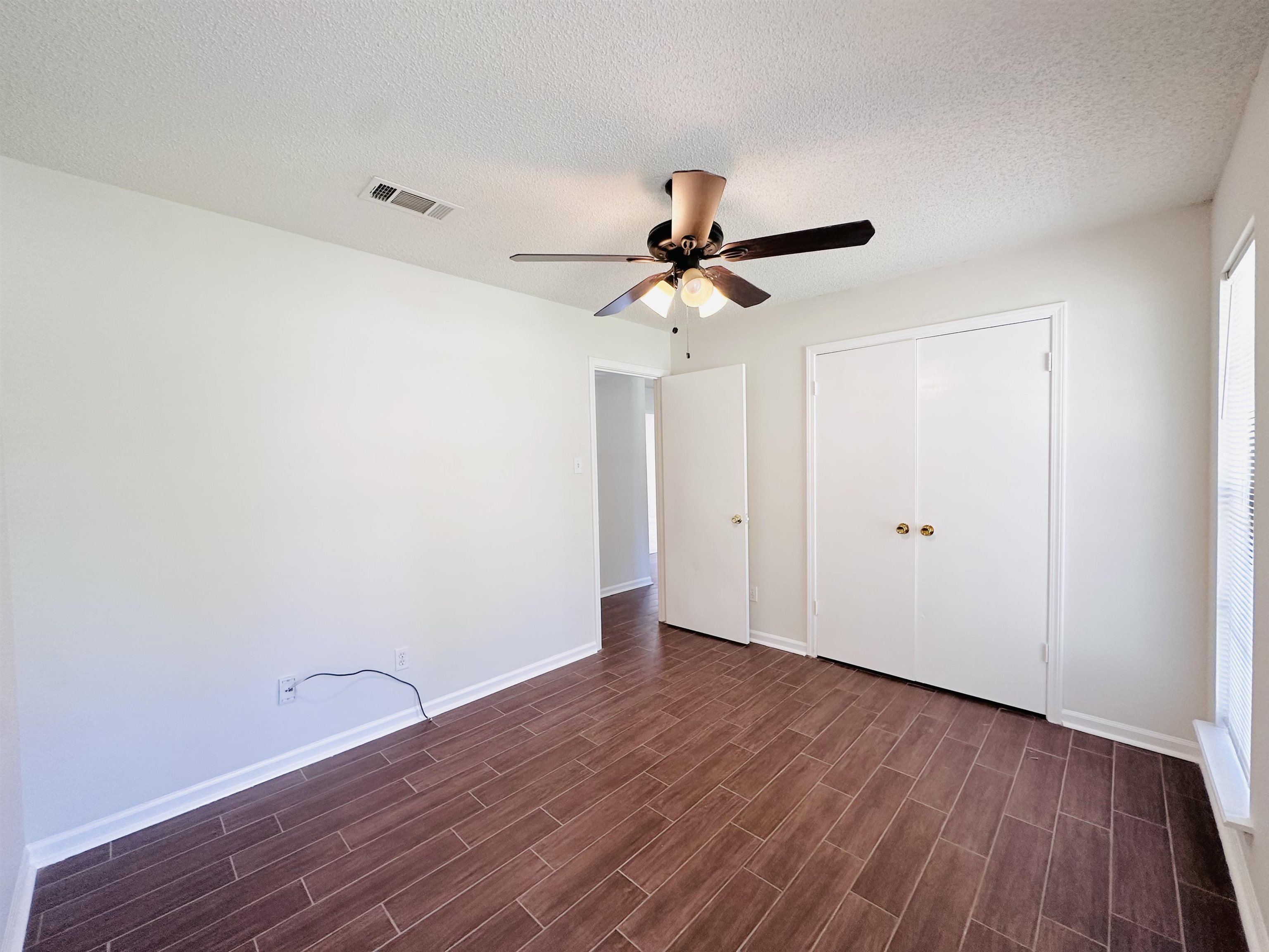 4192 Riche Road Memphis, TN 38128 - Photo 23 of 32 a view of room with wooden floor and ceiling fan