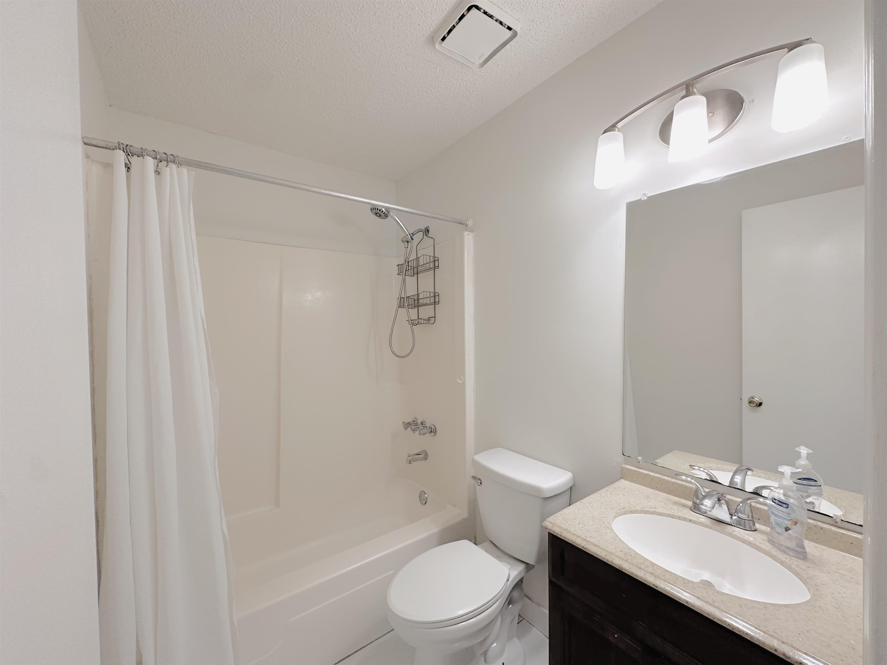 4192 Riche Road Memphis, TN 38128 - Photo 25 of 32 a bathroom with a sink toilet a mirror and shower