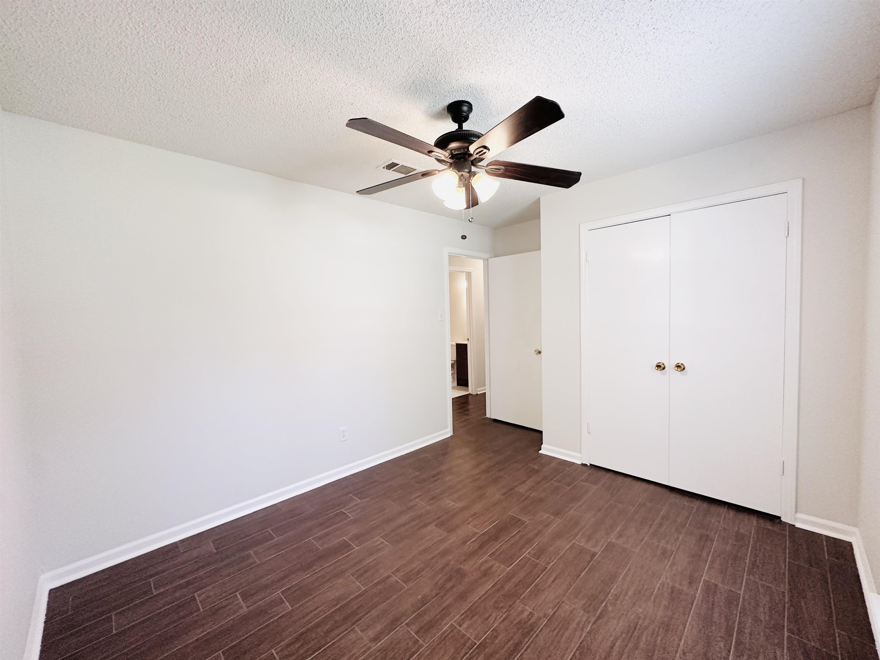 4192 Riche Road Memphis, TN 38128 - Photo 27 of 32 a view of an empty room with wooden floor