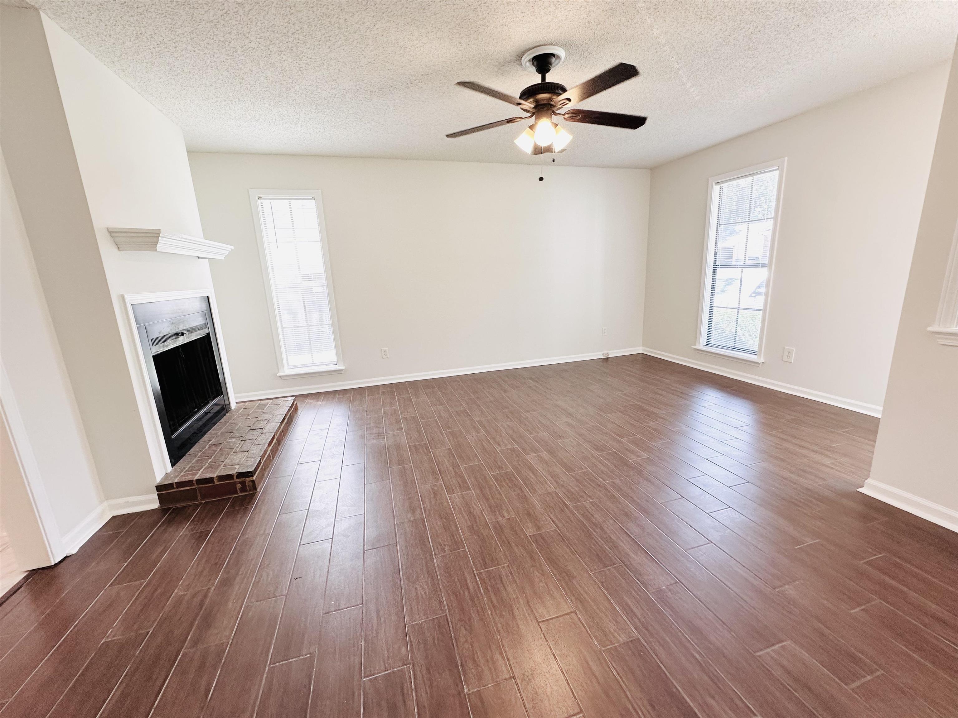 4192 Riche Road Memphis, TN 38128 - Photo 7 of 32 a view of livingroom with hardwood floor and a ceiling fan