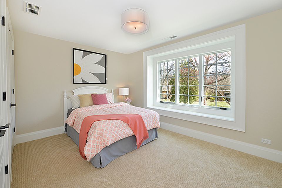 330 Brookside Lane Glencoe, IL 60022 - Photo 23 of 40 a bedroom with a bed and a large window