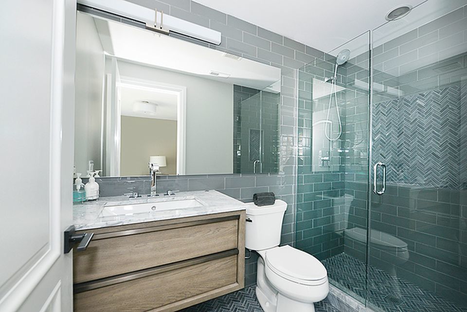 330 Brookside Lane Glencoe, IL 60022 - Photo 27 of 40 a bathroom with a sink toilet and shower