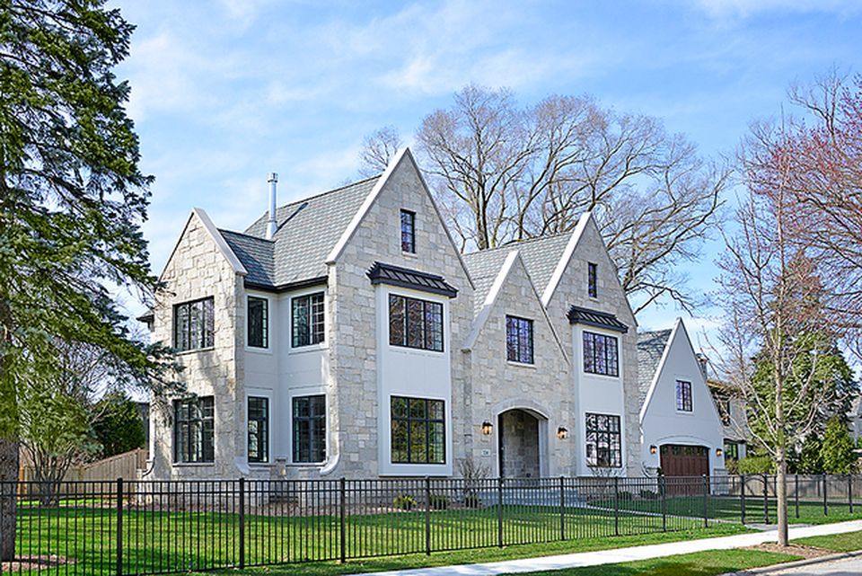 330 Brookside Lane Glencoe, IL 60022 - Photo 39 of 40 a view of a large white house with large windows and a big yard and large trees