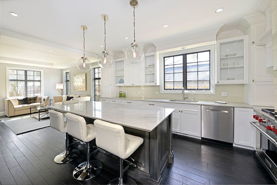 330 Brookside Lane Glencoe, IL 60022 - Photo 10 of 40 a kitchen with center island white cabinets and stainless steel appliances