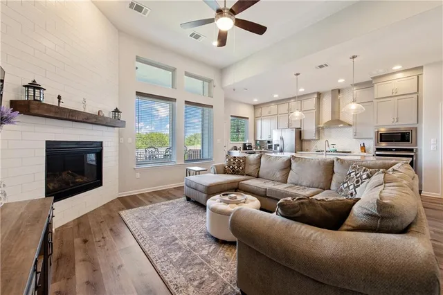 a living room with furniture and a fireplace