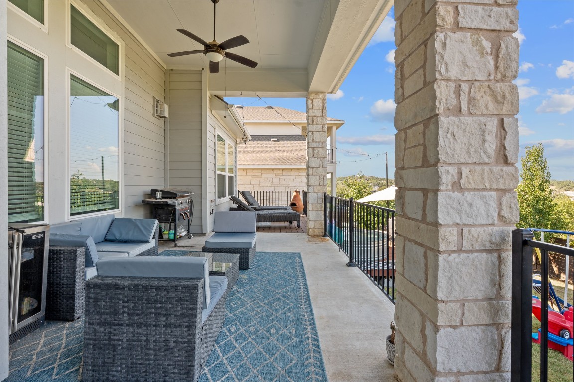 7117 Jument Drive Austin, TX 78738 - Photo 32 of 40 View of patio / terrace featuring a ceiling fan, a grill, an outdoor living space, and beverage cooler