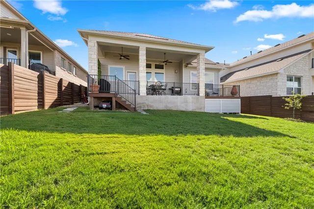 a view of a house with a yard and porch