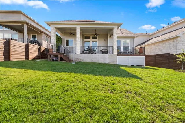 a view of a house with a yard and porch