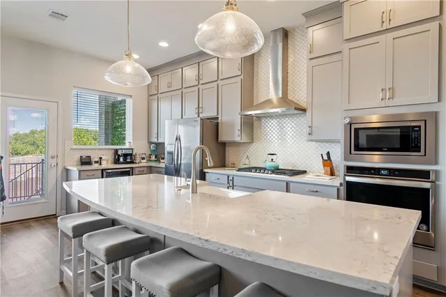 a large kitchen with lots of counter space and window