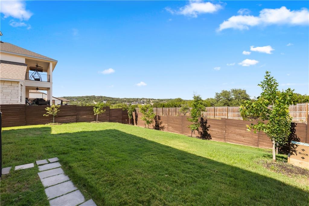 7117 Jument Drive Austin, TX 78738 - Photo 9 of 40 Fenced backyard featuring a balcony