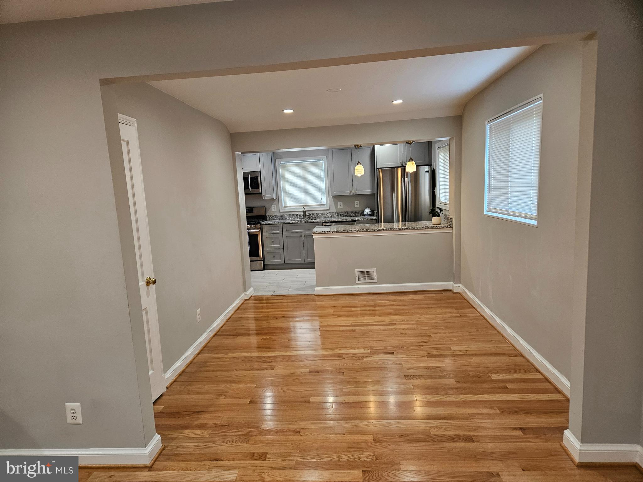 11102 Bucknell Drive Silver Spring, MD 20902 - Photo 5 of 14 a view of kitchen with wooden floor