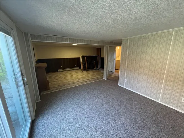 a view of room with furniture and window