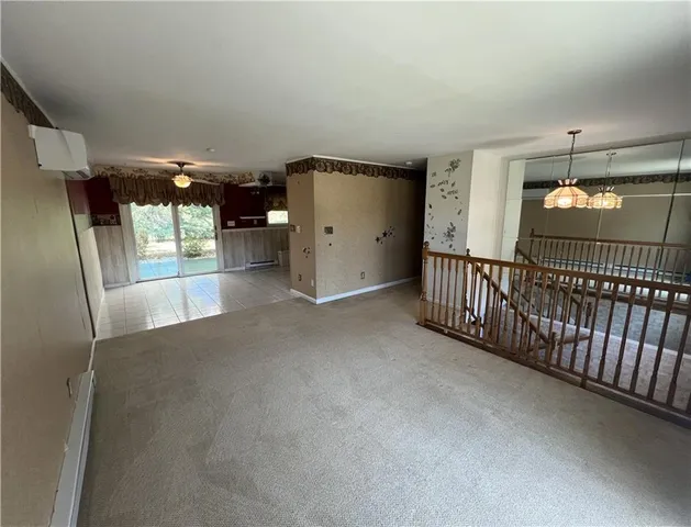 a view of empty room with floor to ceiling window