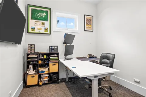 a view of a workspace with furniture